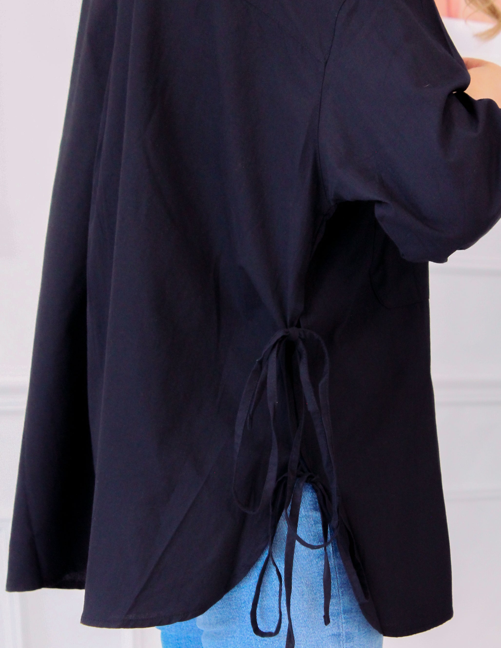 Shirt with lacing on the sides