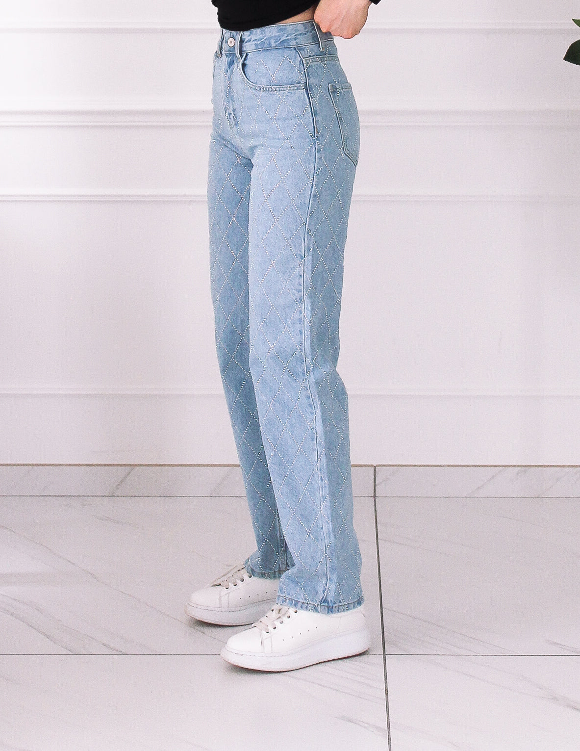 Blue jeans decorated with rhinestones