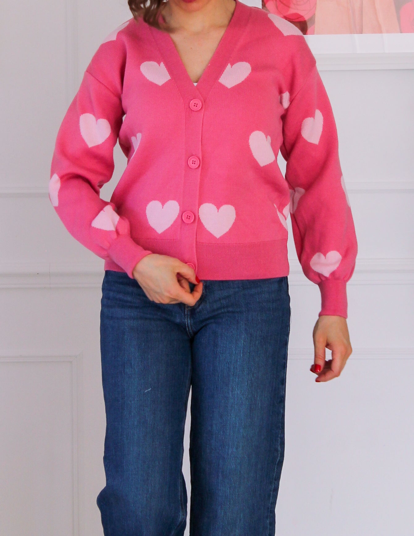Short cardigan with powder pink heart patterns