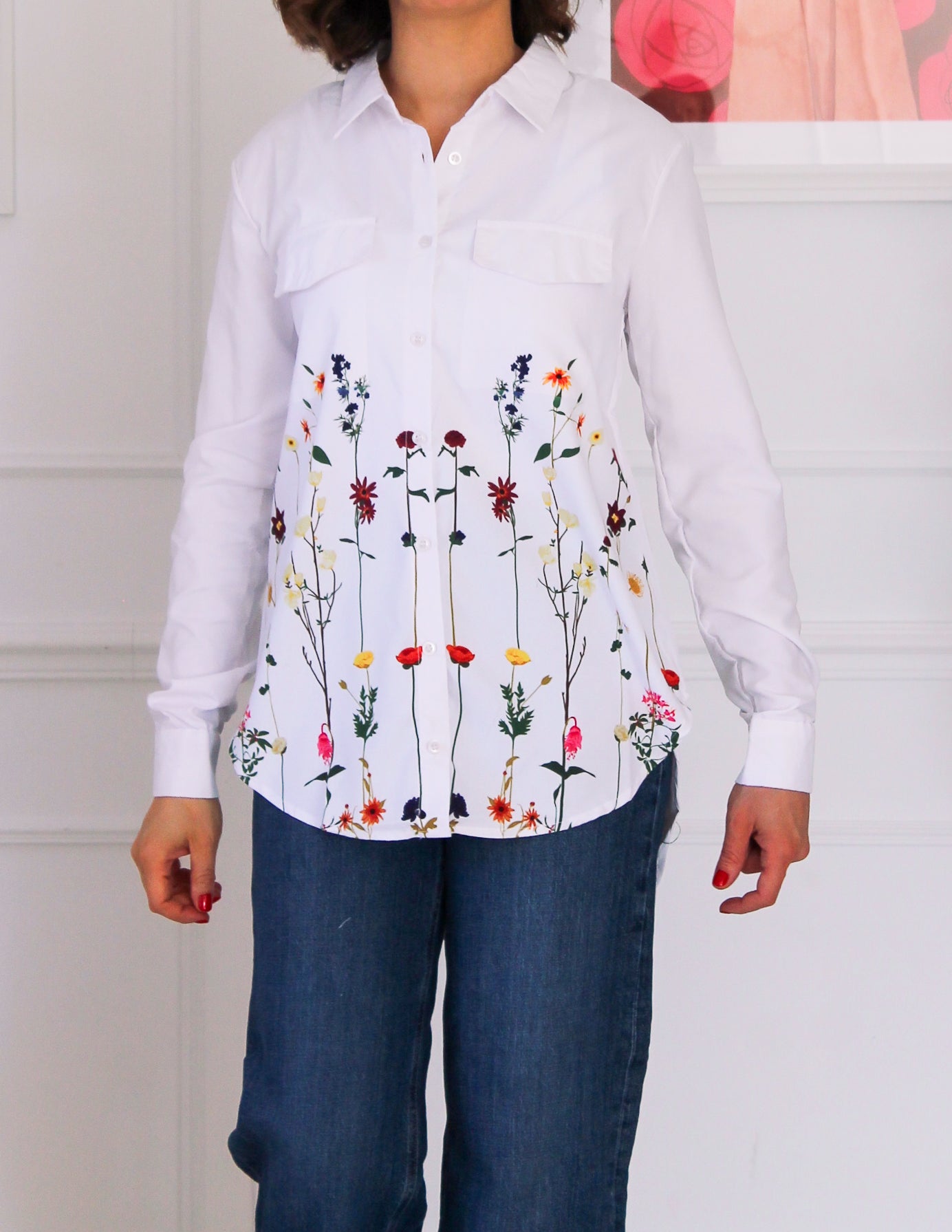 White shirt decorated with floral patterns