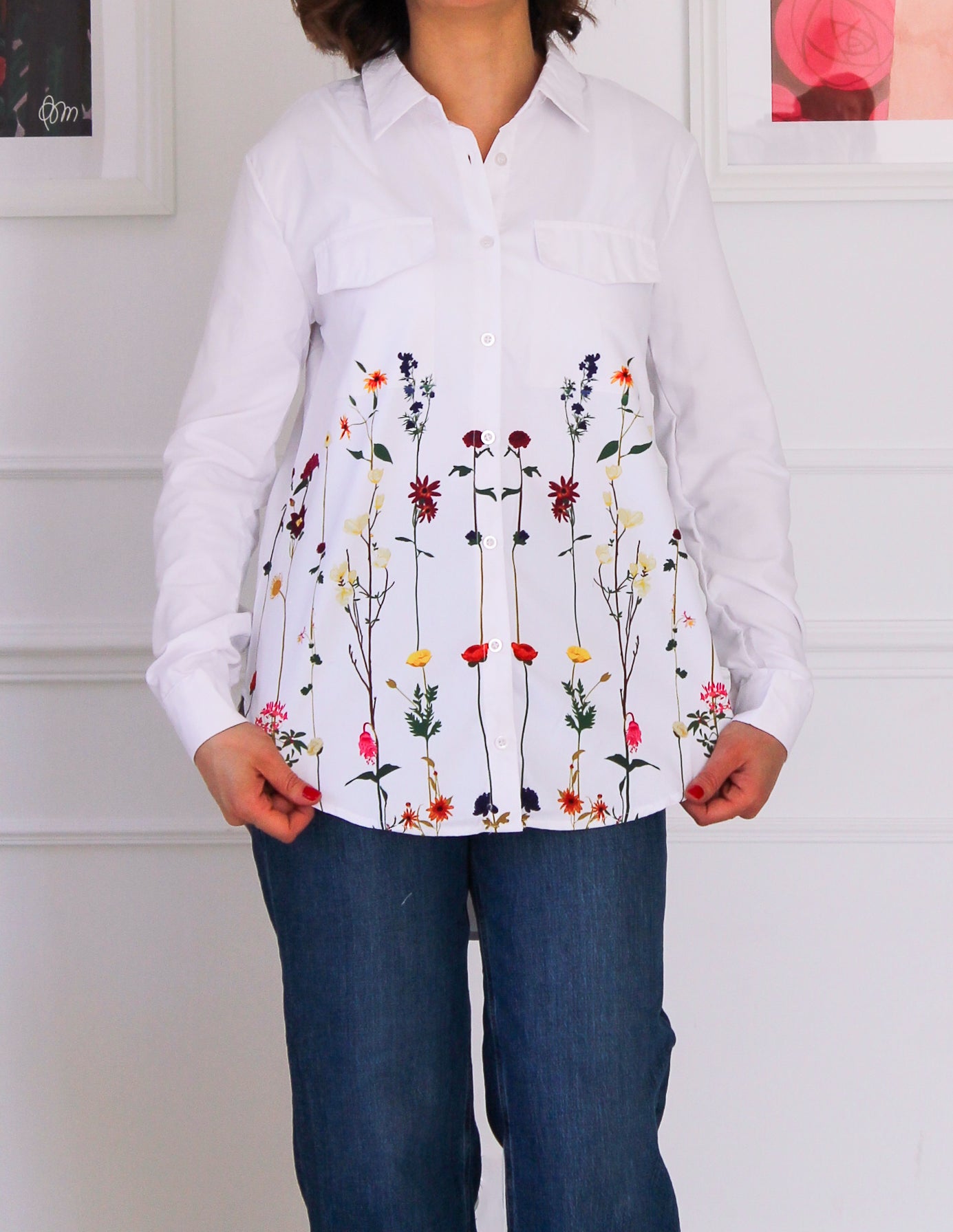 White shirt decorated with floral patterns