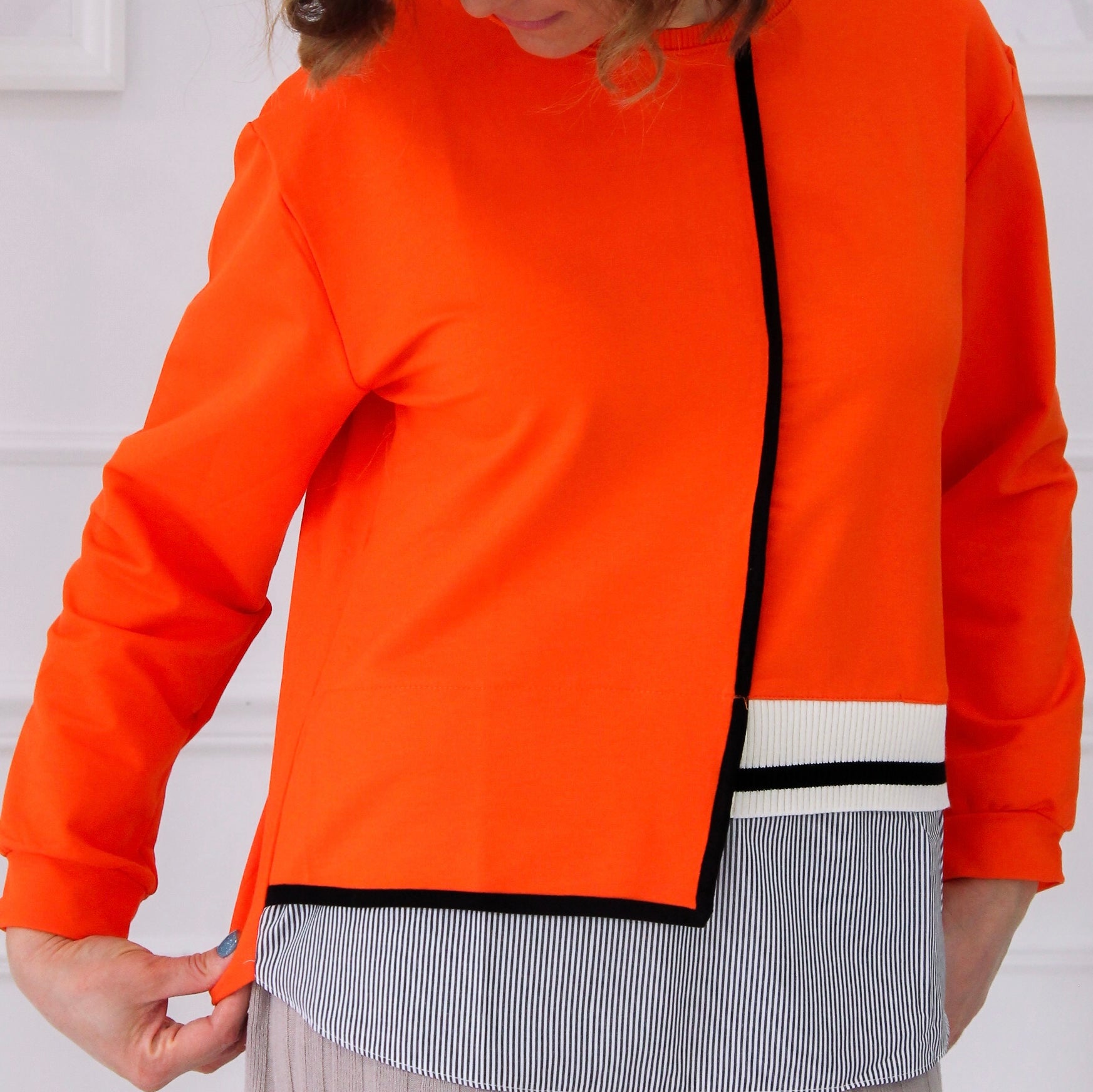 Pull orange bi-matière